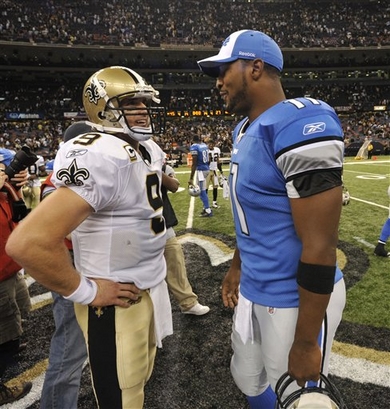 New  Orleans  Saints'  quarterback  Drew Brees (9)  left,  and  Detroit  Lions'   backup  quarterback   Daunte  Culpepper  meet  after  the  game  to   discuss  the  day's  events.   The  Saints   defeated  the  Lions   45-27  and   Brees  would   throw  for   6  TD's   and  an  int,  during  the  game  played  in  New  Orleans,  Louisiana.   picture  appears  courtesy  of ap/photo/Bill  Feig  .................. 