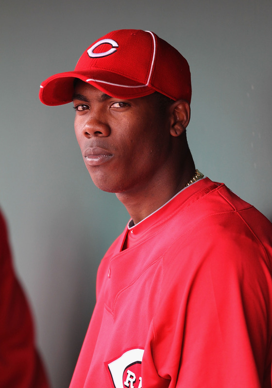 Goodyear , Az,. Relief pitcher Aroldis Chapman (54) of the Cincinnati Reds sits in the dugout during the MLB spring training game against the Kansas City Royals at Goodyear Ballpark on March 8, 2010 in Goodyear, Arizona.  photo appears  courtesy of  Getty  Images/  Christian  Petersen  .............