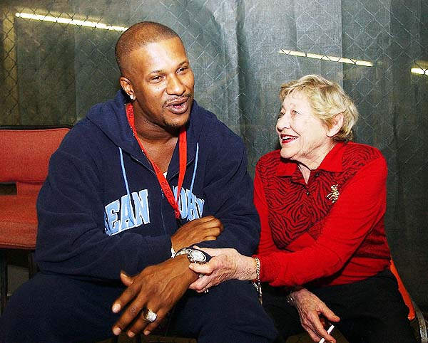 The late  Marge  Schott  former owner  of  the  Cincinnati  Reds  is  seen  here  with  Eric  Davies.   Do   you get the impression  that   Davies was   rebuffing   Schott's sexuall  advances  at the  time  ?  As   we  all  know  what  Marge's  alleged   feelings  were  to  minorities by  enlarge.   This  may well  have  been  a  way  to make  amends.   LOL,LOL, LOL  !!!    photo  appears  courtesy  of    Ernest  Coleman ..................